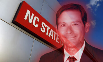 A headshot of professor Christopher Rock in front of the NC State Gateway